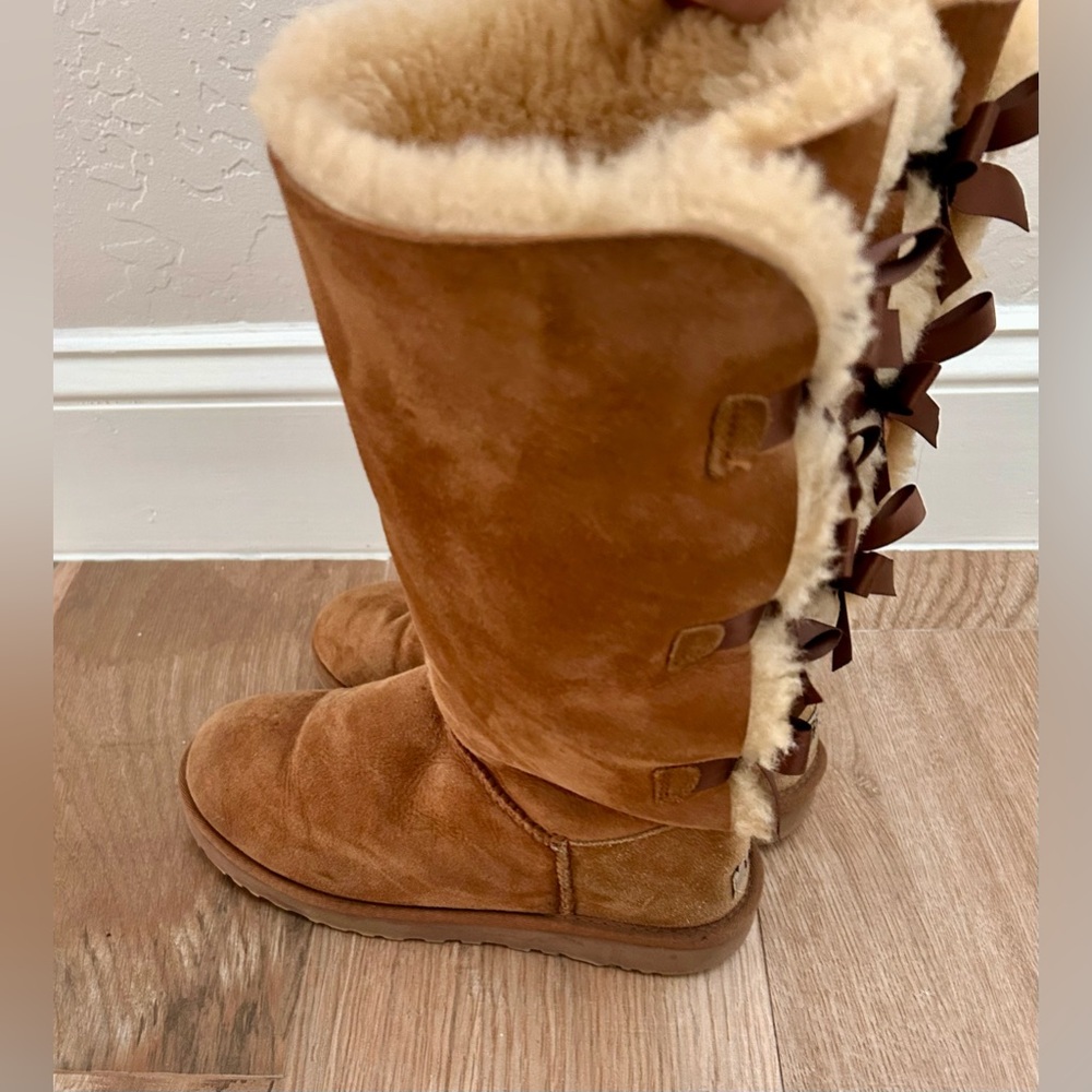 Cozy Brown Winter UGG Women's Bailey Bow Tall II boots in chestnut color. - Picture 4 of 5